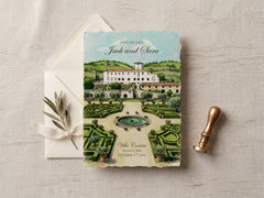A square wedding save-the-date card featuring a watercolor illustration of Villa Contadito in Tuscany, Italy, styled on a light linen surface with a white envelope, a small olive sprig, and a brass stamp.